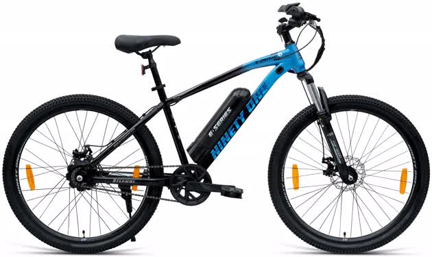 Rider commuting on an electric bike through Pune city with Bodke Cycles branding