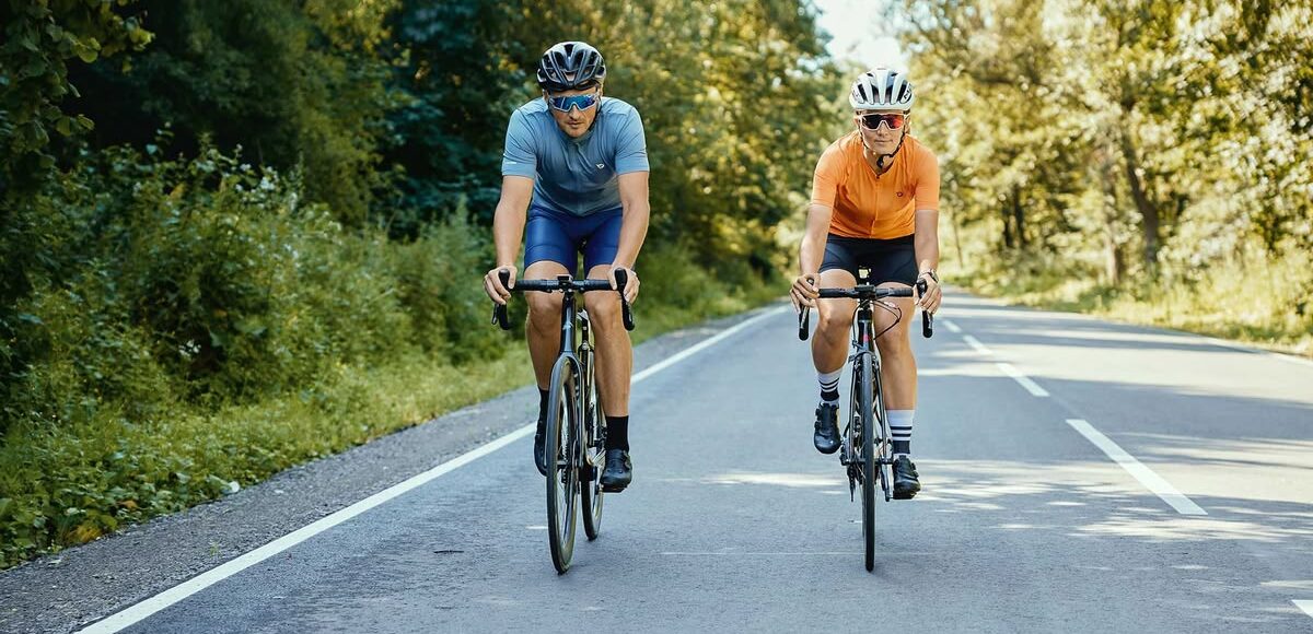 Person cycling outdoors on a bright day representing the daily health and lifestyle benefits of cycling