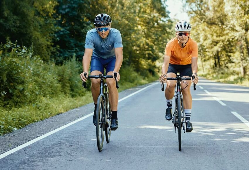 Person cycling outdoors on a bright day representing the daily health and lifestyle benefits of cycling