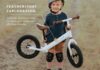 Child riding a bicycle with helmet on a safe outdoor path, representing kids’ cycle selection tips for 2026