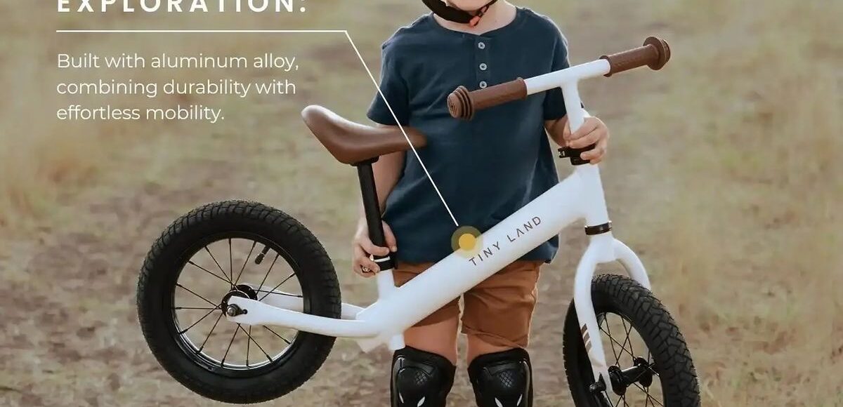 Child riding a bicycle with helmet on a safe outdoor path, representing kids’ cycle selection tips for 2026
