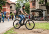 Student riding a Firefox mountain bike on a college campus in Pune showcasing durable alloy frame, disc brakes, and daily commuting performance